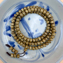 Load image into Gallery viewer, KGT2401-MLN1 Malinau Agarwood Drum Beads 7mm x 5.8mm x 108 beads 11.7gm
