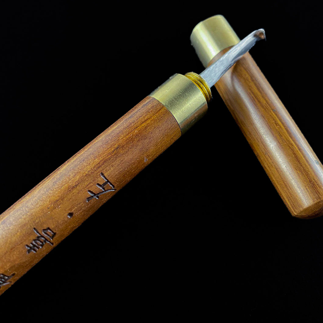 Left hander Shaving knife with wooden holder.